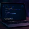 Modern laptop displaying HTML and CSS code with blue neon light – professional web design and WordPress development by PouyaWeb.